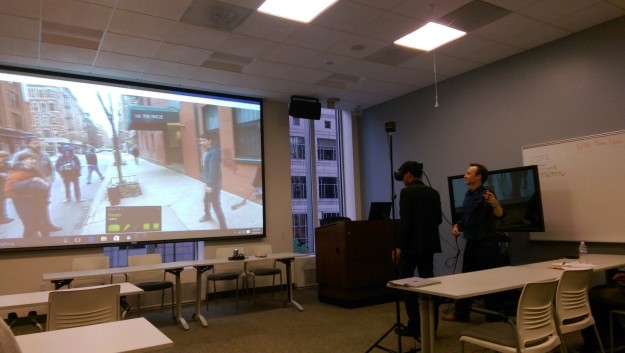 Christian Sullivan wears an HTC Vive to view the virtual reality film “Walking New York” with the assistance of Microsoft CTO Paul Edlund 